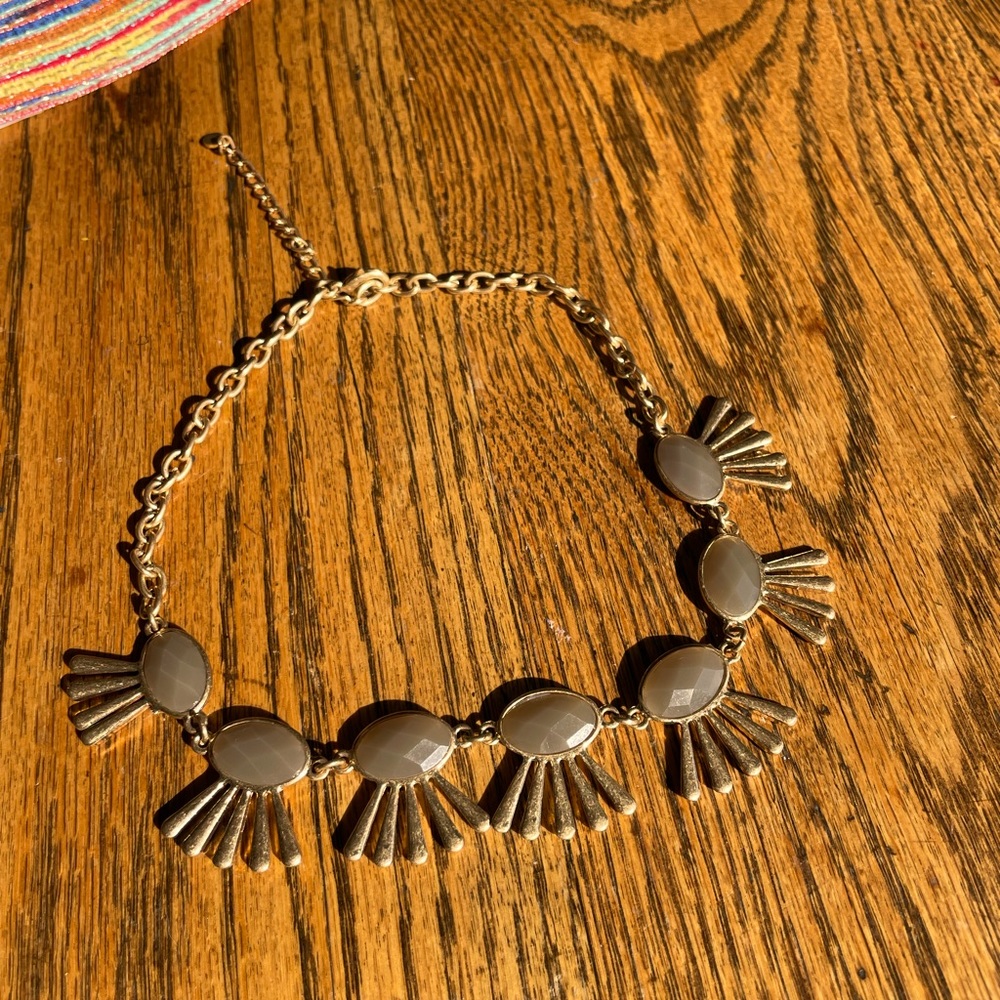 Choker style necklace with topaz colored stones.